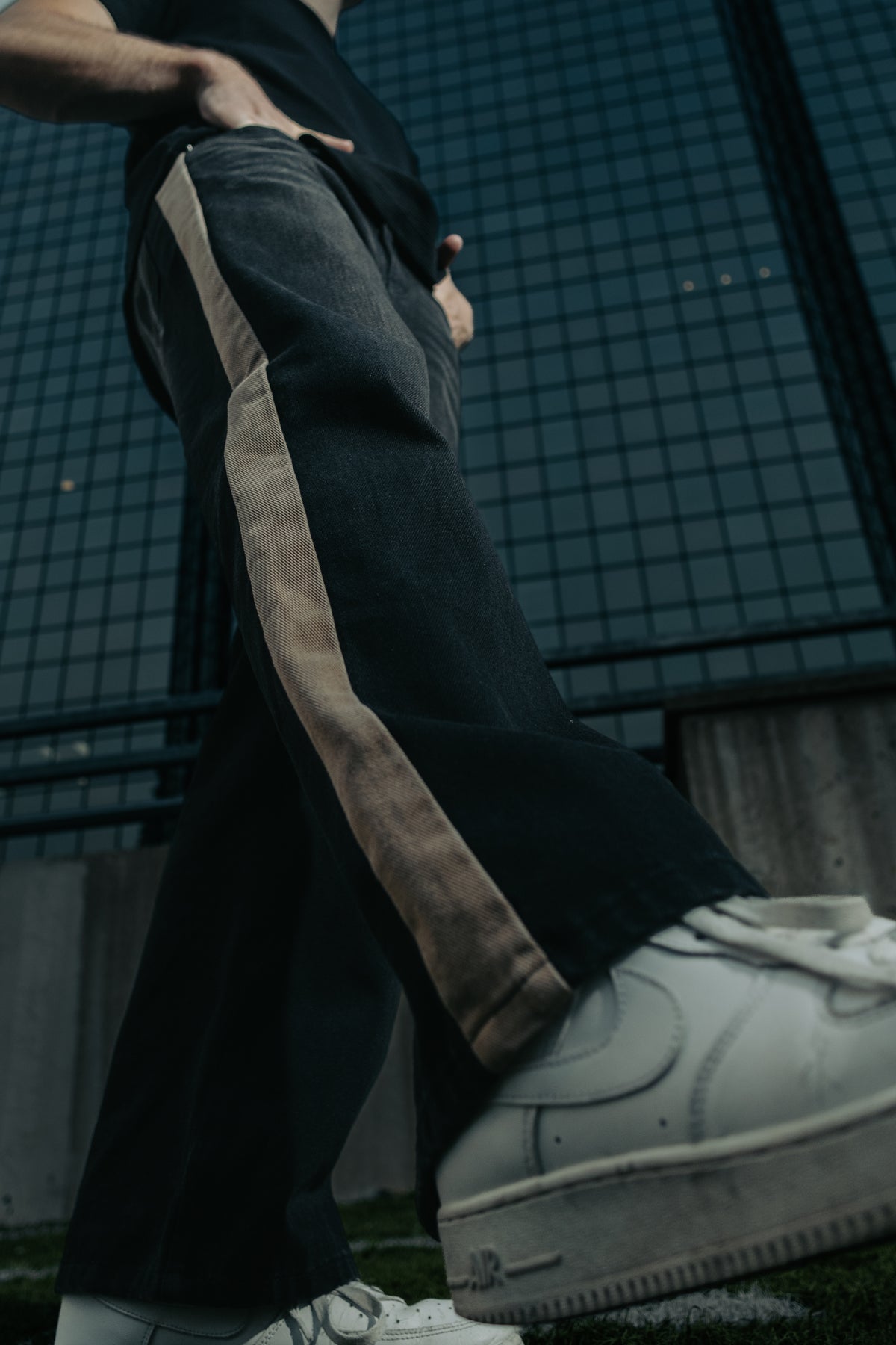 Washed Black denim, close on the wide leg and seam